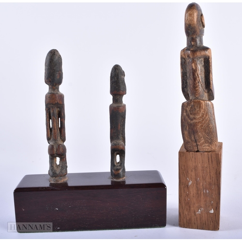 312 - A GROUP OF ANTIQUE AFRICAN TRIBAL CARVED WOOD FIGURES. Largest 15cm high. (5)