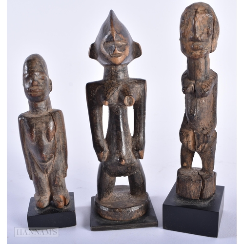 312 - A GROUP OF ANTIQUE AFRICAN TRIBAL CARVED WOOD FIGURES. Largest 15cm high. (5)