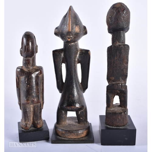 312 - A GROUP OF ANTIQUE AFRICAN TRIBAL CARVED WOOD FIGURES. Largest 15cm high. (5)