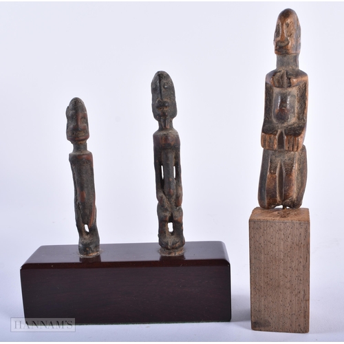 312 - A GROUP OF ANTIQUE AFRICAN TRIBAL CARVED WOOD FIGURES. Largest 15cm high. (5)