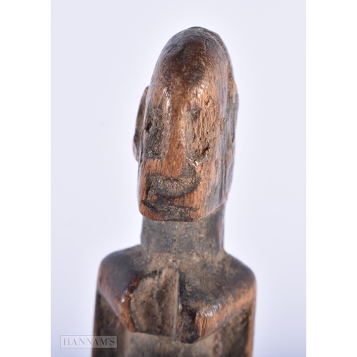 312 - A GROUP OF ANTIQUE AFRICAN TRIBAL CARVED WOOD FIGURES. Largest 15cm high. (5)