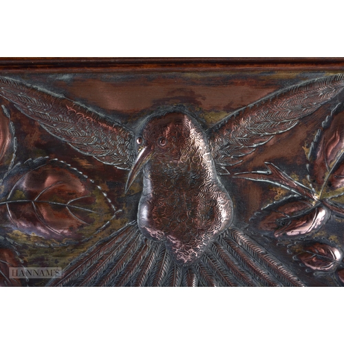 316 - AN ENGLISH ARTS AND CRAFTS OAK AND COPPER REPOUSSE MIRRORED SCREEN. 60cm x 45cm.