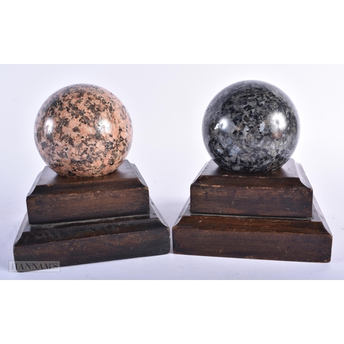 319 - A PAIR OF 19TH CENTURY EUROPEAN GRAND TOUR RHODONITE & LABRADORITE STONE BALLS on wooden bases. 8 cm... 