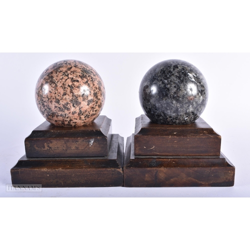 319 - A PAIR OF 19TH CENTURY EUROPEAN GRAND TOUR RHODONITE & LABRADORITE STONE BALLS on wooden bases. 8 cm... 