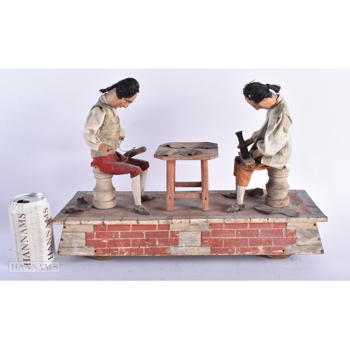 320 - A RARE 19TH CENTURY EUROPEAN FOLK ART AUTOMATON PAINTED WOOD MODEL depicting two leather workers at ... 