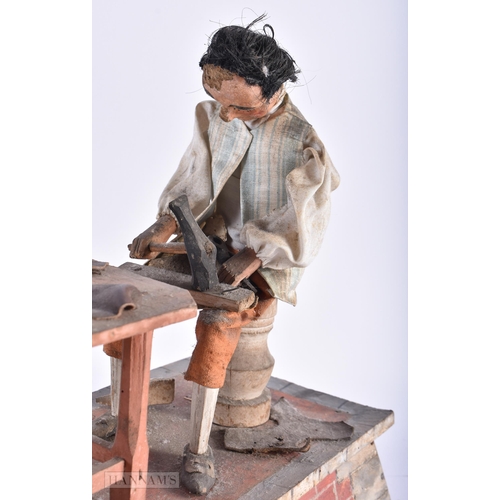 320 - A RARE 19TH CENTURY EUROPEAN FOLK ART AUTOMATON PAINTED WOOD MODEL depicting two leather workers at ... 