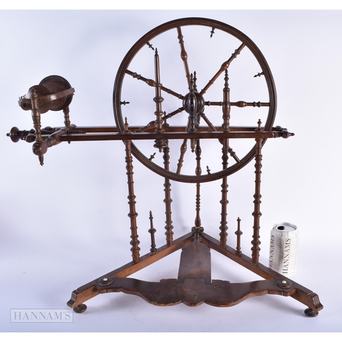 324 - A FINE 18TH/19TH CENTURY ENGLISH MAHOGANY SPINNING WHEEL possibly for a child. 60cm x 60cm.