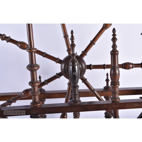 324 - A FINE 18TH/19TH CENTURY ENGLISH MAHOGANY SPINNING WHEEL possibly for a child. 60cm x 60cm.