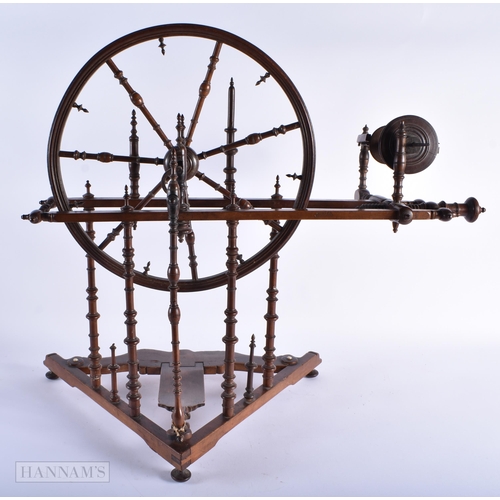 324 - A FINE 18TH/19TH CENTURY ENGLISH MAHOGANY SPINNING WHEEL possibly for a child. 60cm x 60cm.