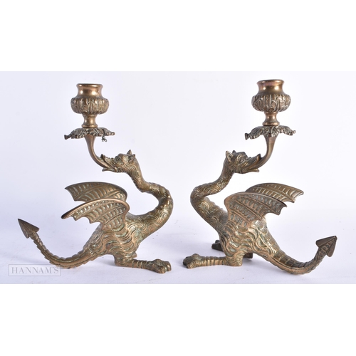 339 - A PAIR OF 19TH CENTURY EUROPEAN MYTHICAL BEAST BRONZE CANDLESTICKS. 18cm x 12 cm.