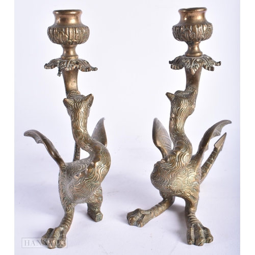 339 - A PAIR OF 19TH CENTURY EUROPEAN MYTHICAL BEAST BRONZE CANDLESTICKS. 18cm x 12 cm.