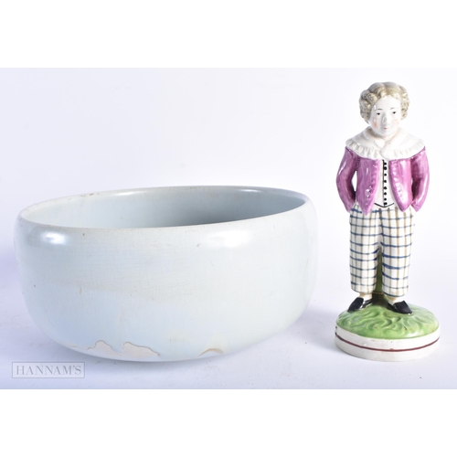 340 - AN EARLY 19TH CENTURY ENGLISH STAFFORDSHIRE PEARLWARE FIGURE OF A MALE together with a robin's egg g... 