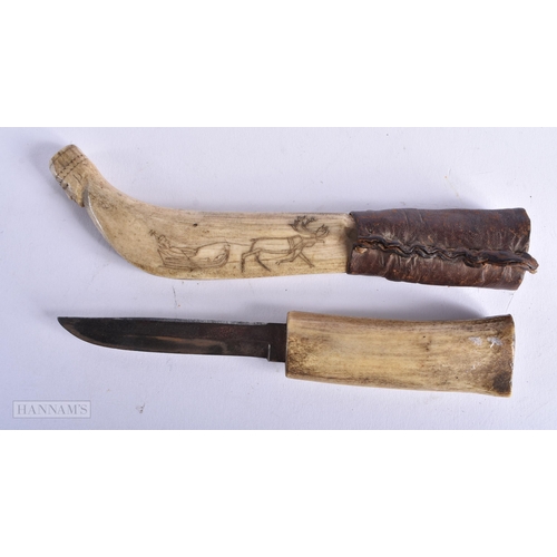 341 - AN ANTIQUE TRIBAL GREENLAND ESKIMO CARVED CARIBOU ANTLER KNIFE. 22cm long. We do not offer in-house ... 