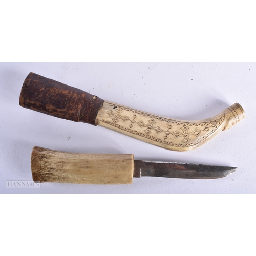 341 - AN ANTIQUE TRIBAL GREENLAND ESKIMO CARVED CARIBOU ANTLER KNIFE. 22cm long. We do not offer in-house ... 