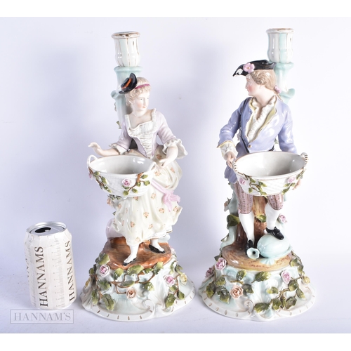 344 - A LARGE PAIR OF LATE 19TH CENTURY GERMAN DRESDEN PORCELAIN CANDLESTICKS formed with figures holding ... 