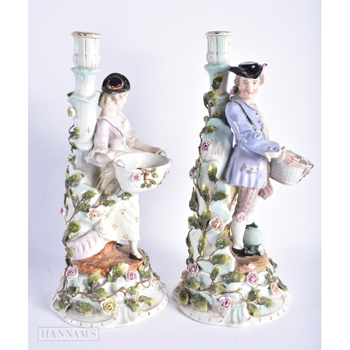 344 - A LARGE PAIR OF LATE 19TH CENTURY GERMAN DRESDEN PORCELAIN CANDLESTICKS formed with figures holding ... 