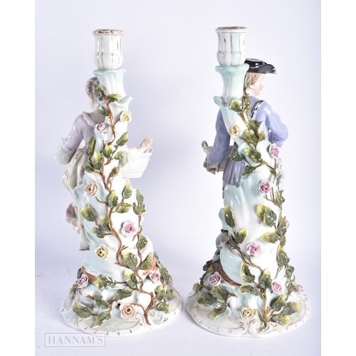 344 - A LARGE PAIR OF LATE 19TH CENTURY GERMAN DRESDEN PORCELAIN CANDLESTICKS formed with figures holding ... 