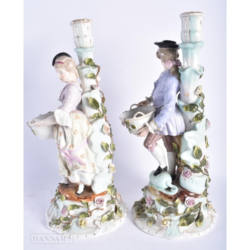 344 - A LARGE PAIR OF LATE 19TH CENTURY GERMAN DRESDEN PORCELAIN CANDLESTICKS formed with figures holding ... 