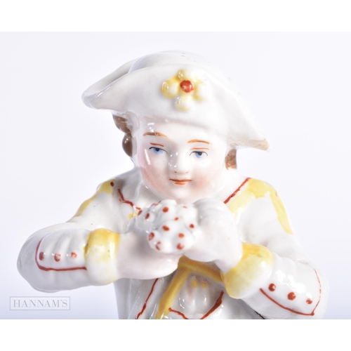 355 - AN ANTIQUE CONTINENTAL PORCELAIN FIGURE OF A BOY. 13 cm high.