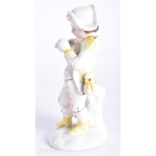 355 - AN ANTIQUE CONTINENTAL PORCELAIN FIGURE OF A BOY. 13 cm high.