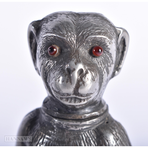 357 - TWO EARLY VICTORIAN NOVELTY PEWTER DESK SANDERS with glass eyes, modelled as a dog and a monkey. Lar... 