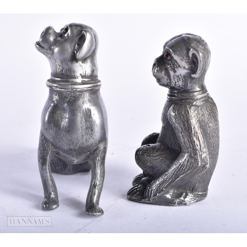 357 - TWO EARLY VICTORIAN NOVELTY PEWTER DESK SANDERS with glass eyes, modelled as a dog and a monkey. Lar... 