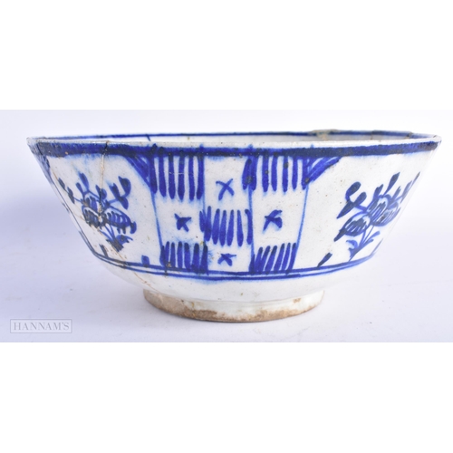 365 - A 17TH/18TH CENTURY PERSIAN ISLAMIC BLUE AND WHITE POTTERY BOWL painted with foliage. 25 cm diameter... 