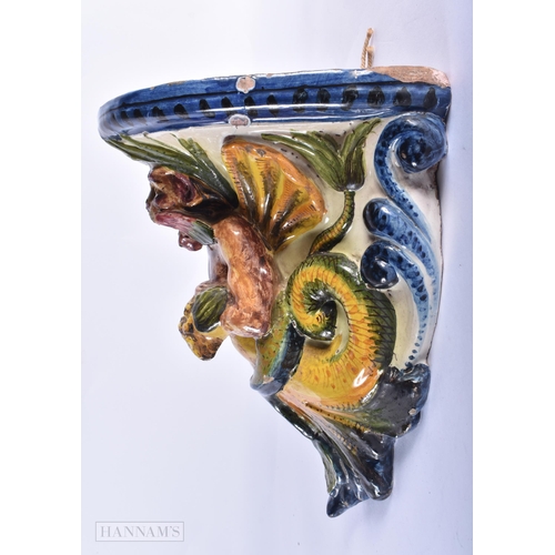 368 - AN EARLY 19TH CENTURY ITALIAN FAIENCE POTTERY GROTESQUE WALL BRACKET. 27cm x 20 cm.