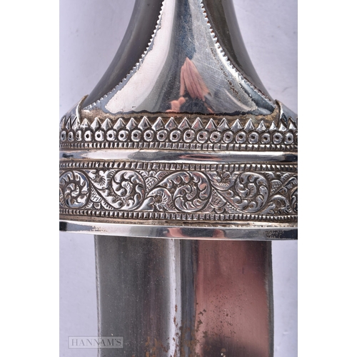 378 - TWO ANTIQUE OMANI JAMBIYA DAGGERS. 27cm wide. (2)  We do not offer in-house shipping on bladed items... 