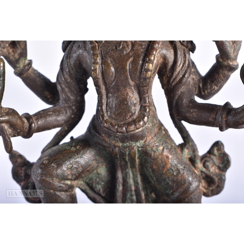 387 - AN 18TH CENTURY INDIAN BRONZE FIGURE OF KALI. 11.5 cm x 7 cm.