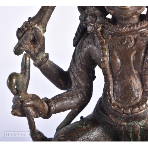 387 - AN 18TH CENTURY INDIAN BRONZE FIGURE OF KALI. 11.5 cm x 7 cm.