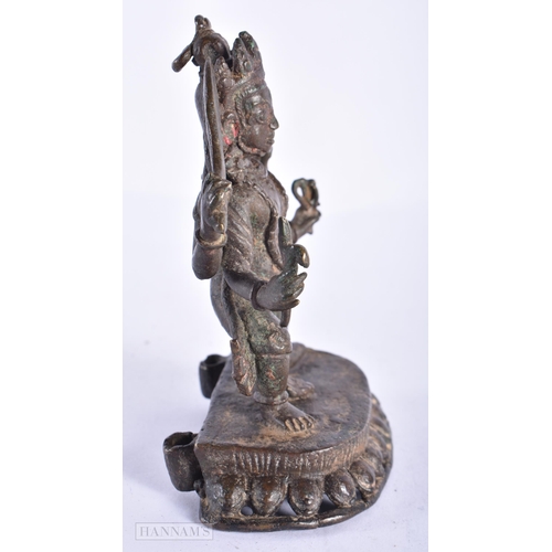 387 - AN 18TH CENTURY INDIAN BRONZE FIGURE OF KALI. 11.5 cm x 7 cm.