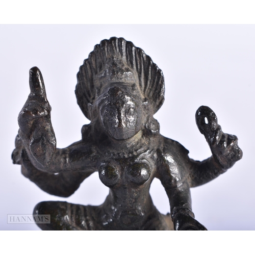 393 - A 15TH/16TH CENTURY INDIAN BRONZE KALI DEITY. 6 cm x 4 cm.