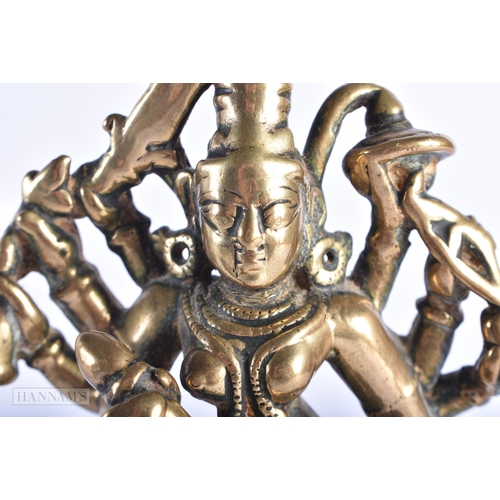 397 - AN 18TH CENTURY INDIAN BRONZE FIGURE OF DURGA modelled with attendants. 17 cm x 7 cm.