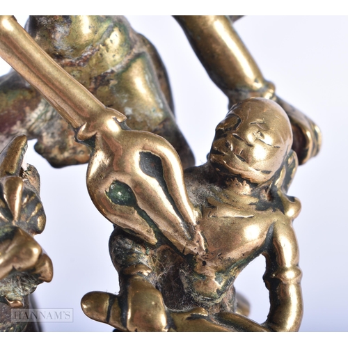 397 - AN 18TH CENTURY INDIAN BRONZE FIGURE OF DURGA modelled with attendants. 17 cm x 7 cm.