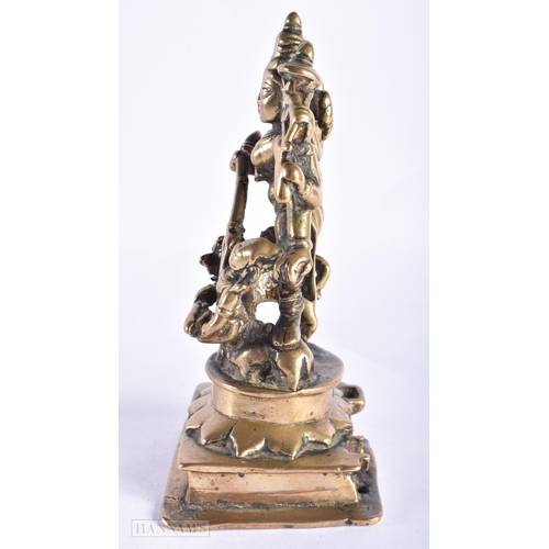 397 - AN 18TH CENTURY INDIAN BRONZE FIGURE OF DURGA modelled with attendants. 17 cm x 7 cm.