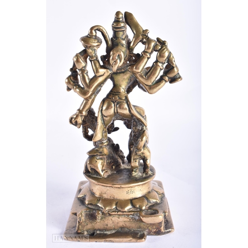 397 - AN 18TH CENTURY INDIAN BRONZE FIGURE OF DURGA modelled with attendants. 17 cm x 7 cm.