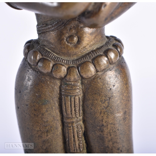 398 - A RARE 18TH CENTURY INDIAN BRONZE FIGURE OF KRISHNA unusually modelled with one leg reversed. 18cm h... 