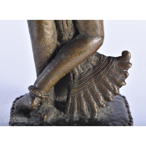 398 - A RARE 18TH CENTURY INDIAN BRONZE FIGURE OF KRISHNA unusually modelled with one leg reversed. 18cm h... 