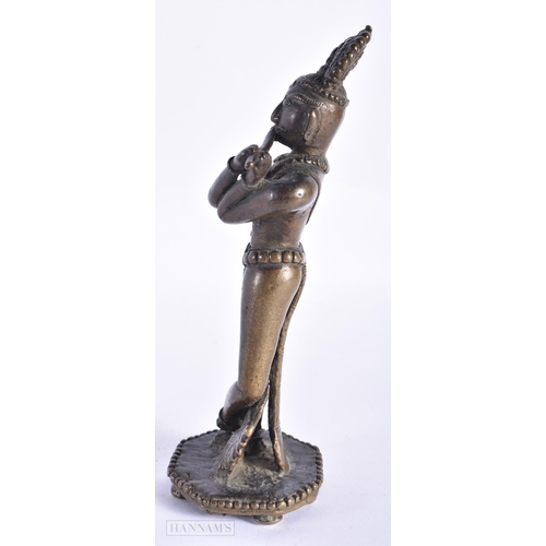 398 - A RARE 18TH CENTURY INDIAN BRONZE FIGURE OF KRISHNA unusually modelled with one leg reversed. 18cm h... 