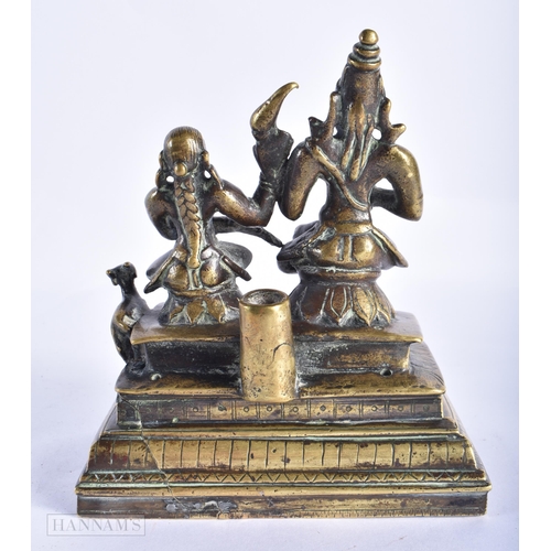 399 - AN 18TH/19TH CENTURY INDIAN BRONZE FIGURE OF SHIV AND PARVATI. 17 cm x 12 cm.