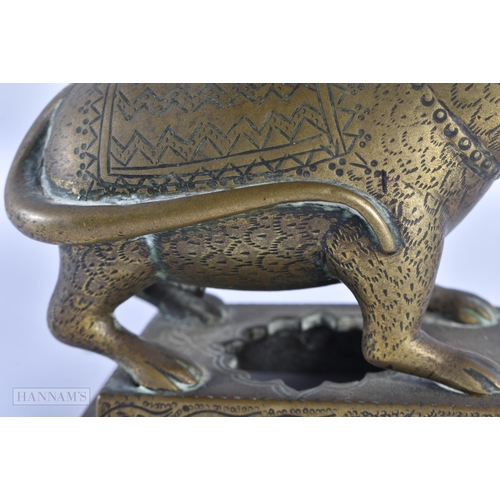 40 - AN UNUSUAL 18TH/19TH CENTURY INDIAN BRONZE LOTUS FORM OIL LAMP formed as a standing animal engraved ... 