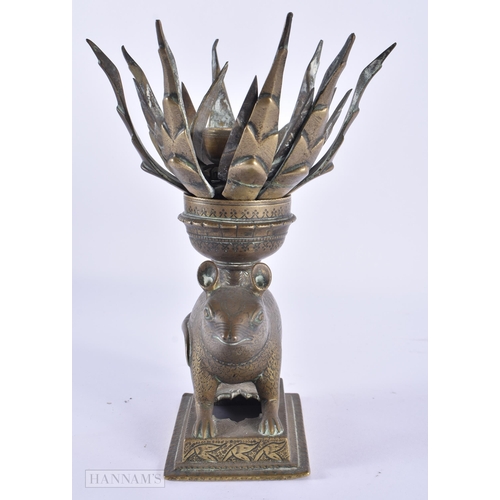 40 - AN UNUSUAL 18TH/19TH CENTURY INDIAN BRONZE LOTUS FORM OIL LAMP formed as a standing animal engraved ... 