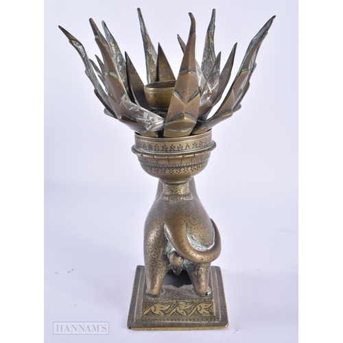 40 - AN UNUSUAL 18TH/19TH CENTURY INDIAN BRONZE LOTUS FORM OIL LAMP formed as a standing animal engraved ... 