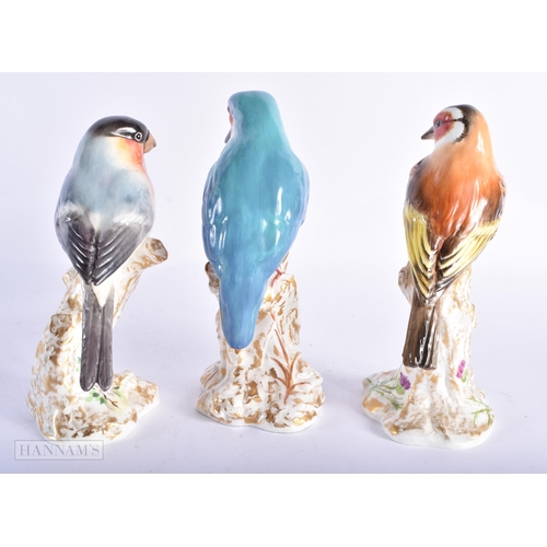 404 - THREE ROYAL WORCESTER PORCELAIN BIRDS. 14cm high. (3)