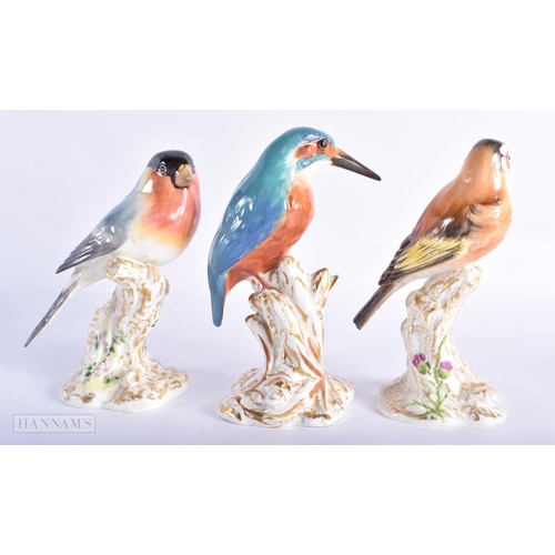 404 - THREE ROYAL WORCESTER PORCELAIN BIRDS. 14cm high. (3)