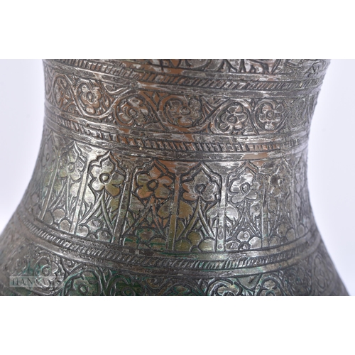 406 - A LARGE 18TH/19TH CENTURY PERSIAN ISLAMIC BRONZE ALLOY JUG decorated all over with birds, foliage an... 