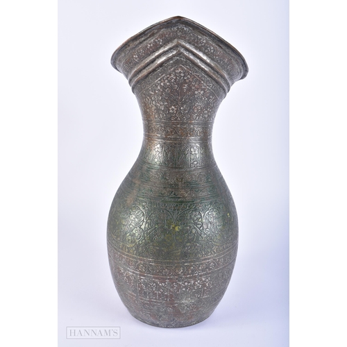 406 - A LARGE 18TH/19TH CENTURY PERSIAN ISLAMIC BRONZE ALLOY JUG decorated all over with birds, foliage an... 