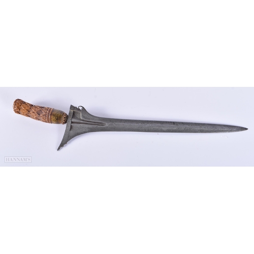 411 - TWO 19TH CENTURY MIDDLE EASTERN KRISS DAGGERS one with brass scabbard. 46 cm long. (2)  We do not of... 