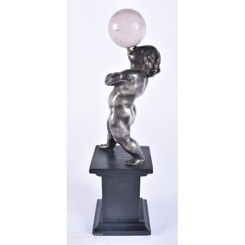 417 - AN UNUSUAL 19TH CENTURY SILVERED BRONZE AND ROCK CRYSTAL GRAND TOUR PUTTI. 25 cm high.